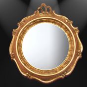 Круглое зеркало в позолоченной раме