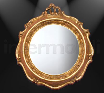 Круглое зеркало в позолоченной раме