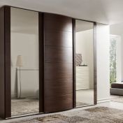 Шкафы с раздвижными закругленными створками