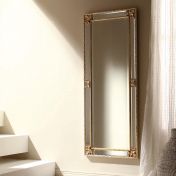 Высокое узкое зеркало в раме с зеркальными вставками